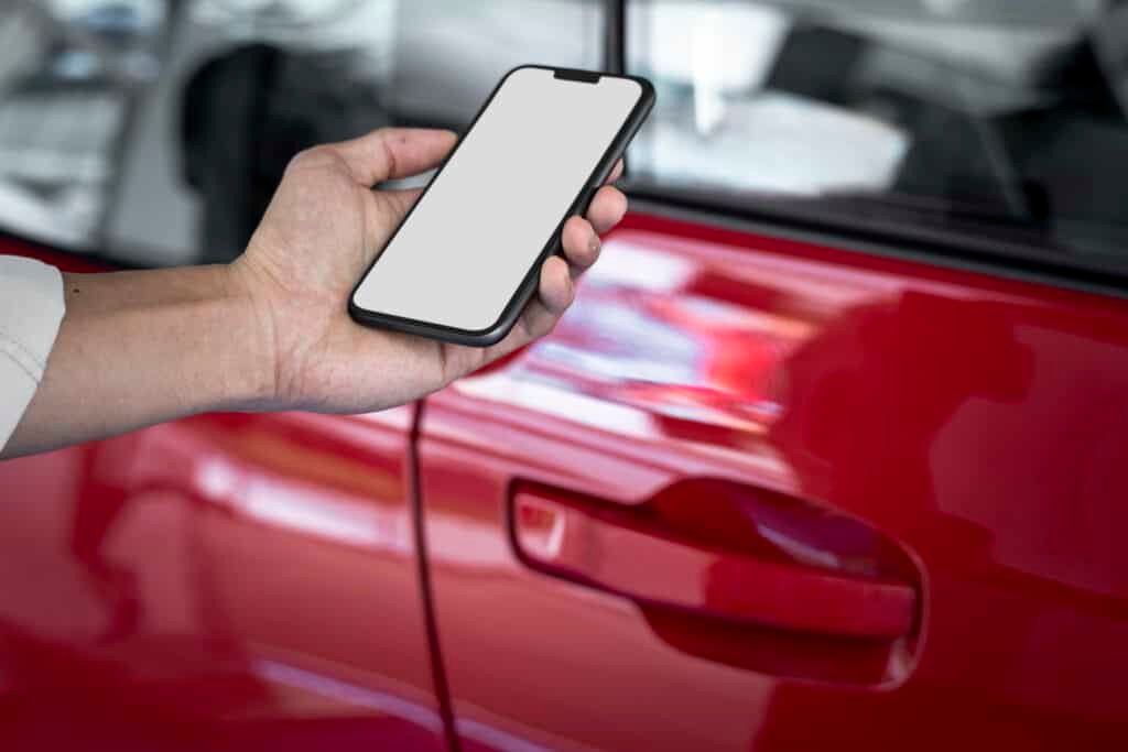 unlocking red car door by smart phone app 2022 12 16 00 33 26 utc