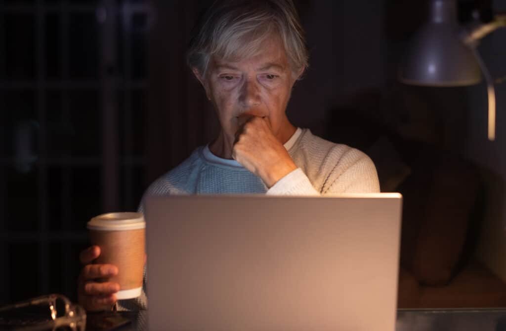 elderly woman browsing social media content at nig 2022 01 19 00 03 54 utc