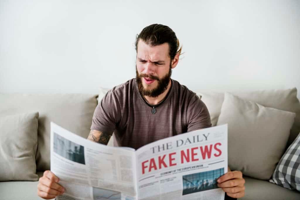 A man recognising Common Characteristics of Fake News