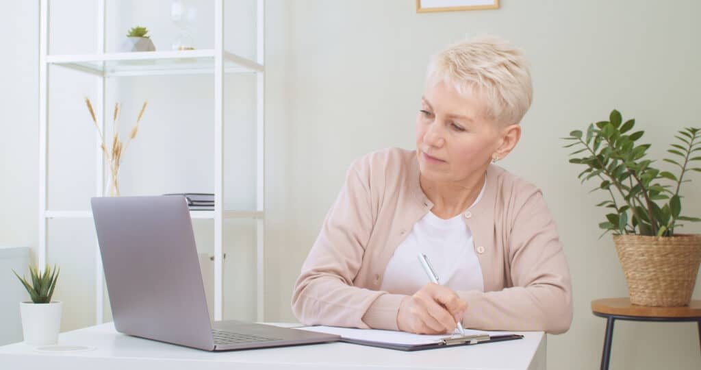 senior woman calculating retirement plan payments 2022 02 23 02 19 48 utc