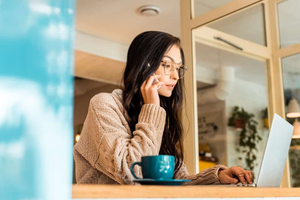 beautiful woman sitting in cafe with laptop and ta 2023 03 30 00 09 02 utc